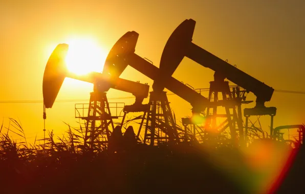Picture sunset, heavy machinery, gas, drilling oil, light effects